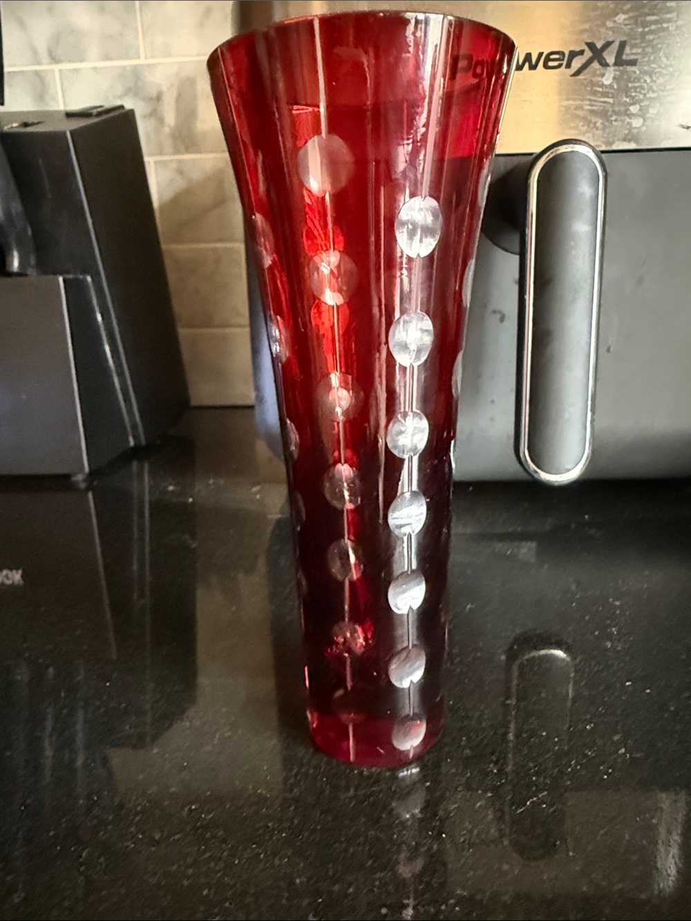 A vintage ruby red cut-to-clear crystal decorative vase.